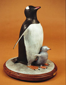 Gentoo Penguin And Chick by David Ginzton